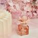 Diffusore Claraluna in vetro con fiore in ceramica rosa con 100 ml di essenza floreale