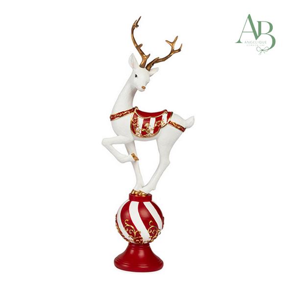 Renna bianca su sfera in resina con decorazioni natalizie h.36,5 cm