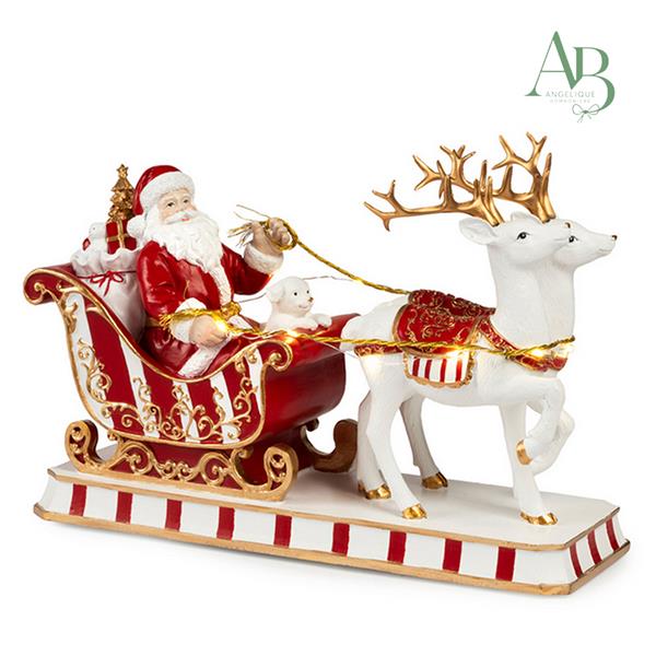 Slitta con renne e babbo natale in resina h.33,5 cm con musica e luci